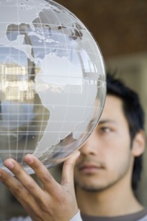 Asian man holding globe