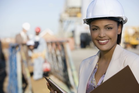 African American businesswoman wearing hardhat