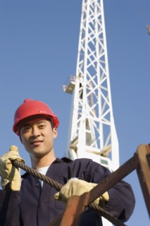 Asian male construction worker wearing hardhat