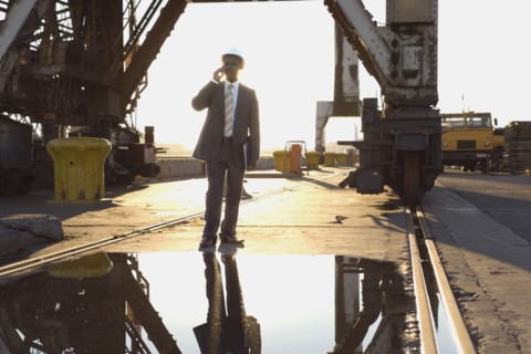 African American businessman wearing hardhat