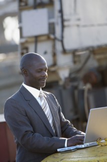 African American businessman typing on laptop