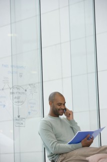 African businessman talking on cell phone