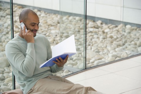 African businessman talking on cell phone