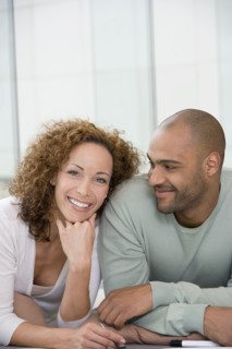 African couple laying on floor