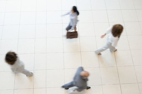 Blurred motion shot of businesspeople walking