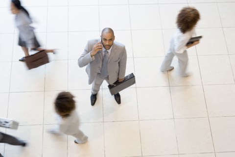 African businessman talking on cell phone