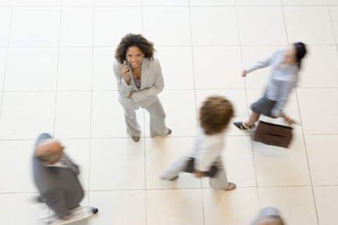 African businesswoman talking on cell phone