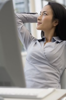 Asian businesswoman looking to side