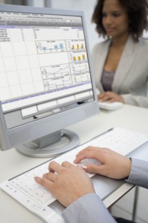 Businesswoman typing on laptop