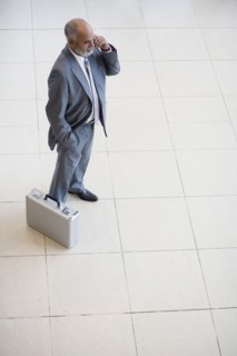 Senior African businessman talking on cell phone