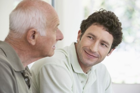 Caucasian father and son smiling