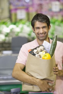 Caucasian man buying groceries
