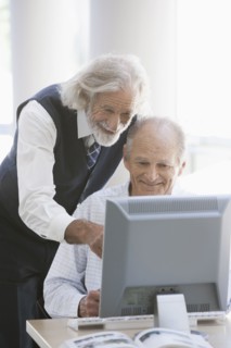 Senior Caucasian businessmen working together in office