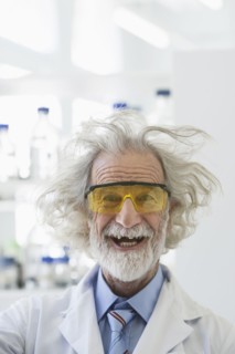 Senior Caucasian scientist with unruly hair in lab