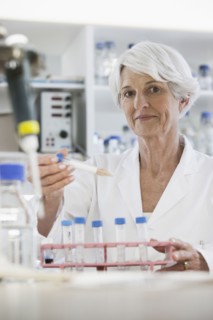 Senior Caucasian scientist testing samples in lab