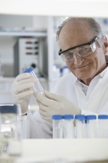 Senior Caucasian scientist examining samples in lab