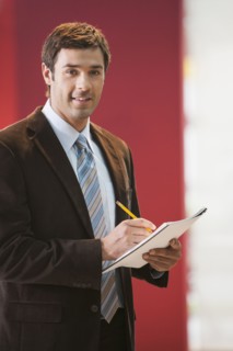 Businessman taking notes in office