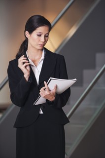 Businesswoman taking notes in office