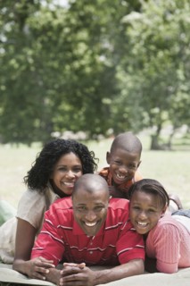 Family relaxing together in park
