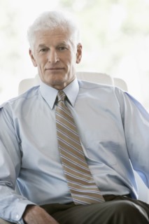 Caucasian businessman sitting in office