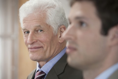 Businessmen standing in office