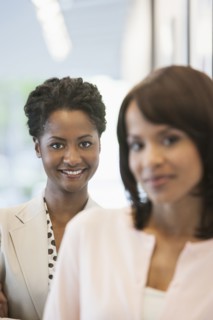 Businesswomen smiling in office