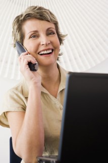 Businesswoman talking on phone in office