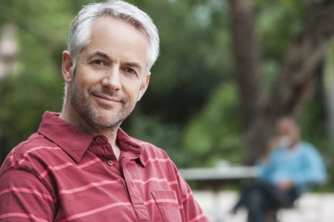 Man smiling outdoors