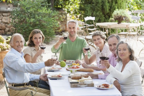 Friends eating together outdoors