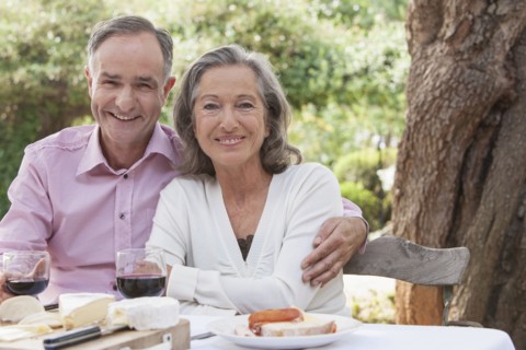 Couple eating together outdoors