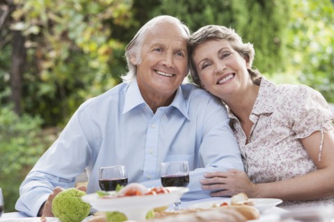 Couple eating together outdoors