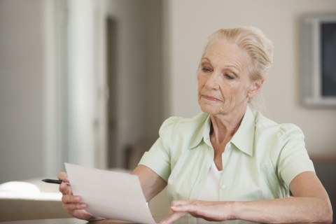 Senior Caucasian woman reading letter