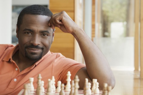 African American man playing chess