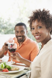 African American couple eating together