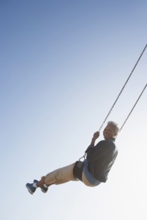 Senior African American woman on swing