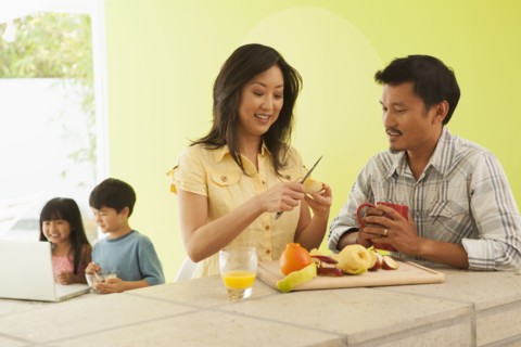 Family relaxing together at breakfast