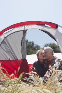 Senior Caucasian couple relaxing at campsite