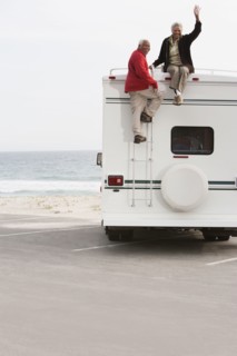 Mixed race Senior couple sitting on RV