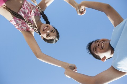 Hispanic children playing outdoors
