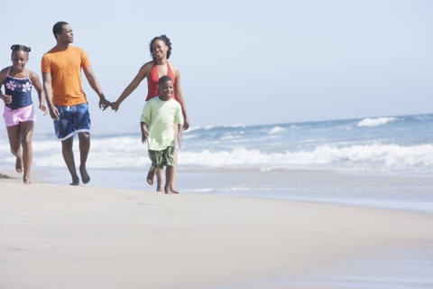 Family walking together on beach