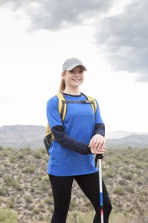 Portrait of smiling Caucasian woman hiking in desert