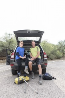 Portrait of hikers sitting in car