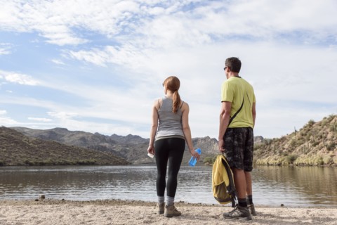 Hikers resting at lake