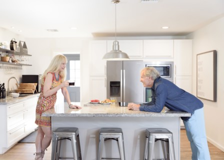 Caucasian couple talking in the kitchen