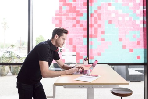 Caucasian man typing on laptop