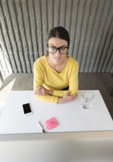 Portrait of Caucasian woman sitting at desk