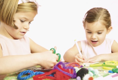 Young girls doing arts and crafts