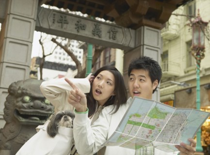 Young Asian couple looking at a map