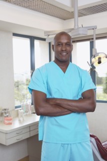 African male dental assistant in office