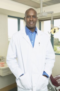 African male dentist in office